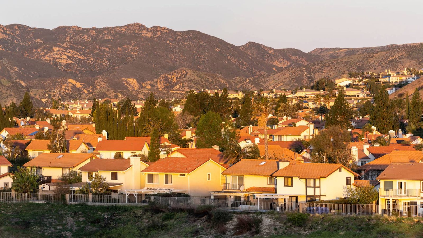 Granada Hills homes below the foothills at sunset